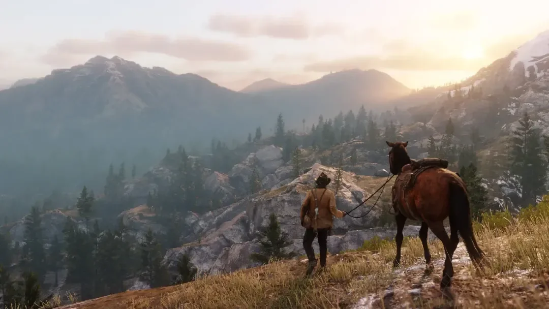 A rider overlooking mountains in Red Dead Redemption 2